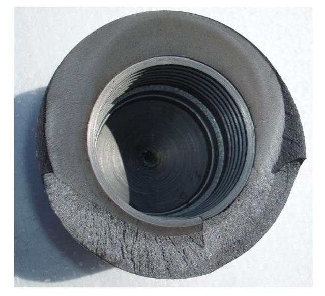 Fracture surface of the failed guide component showing the threaded bore